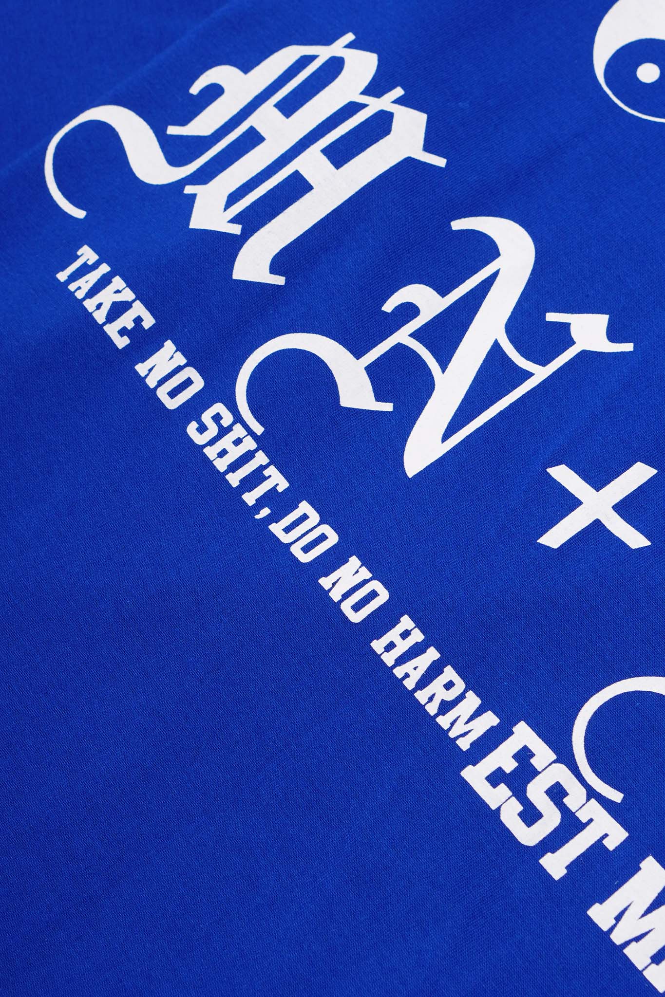 "TAKE NO SHIT, DO NO HARM" TEE IN ELECTRIC BLUE