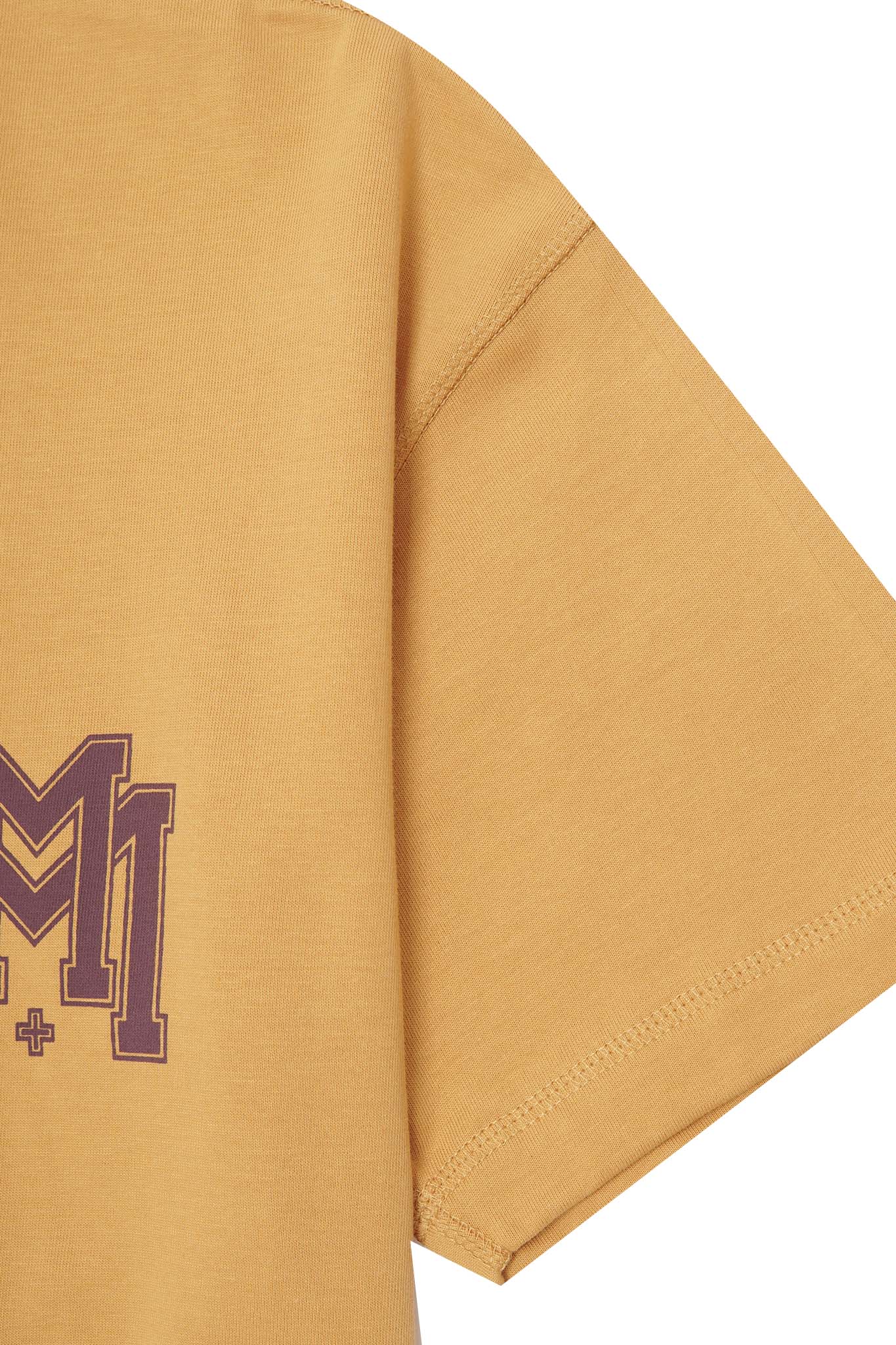 M'$ UNIVERSITY V2 TEE IN MUSTARD