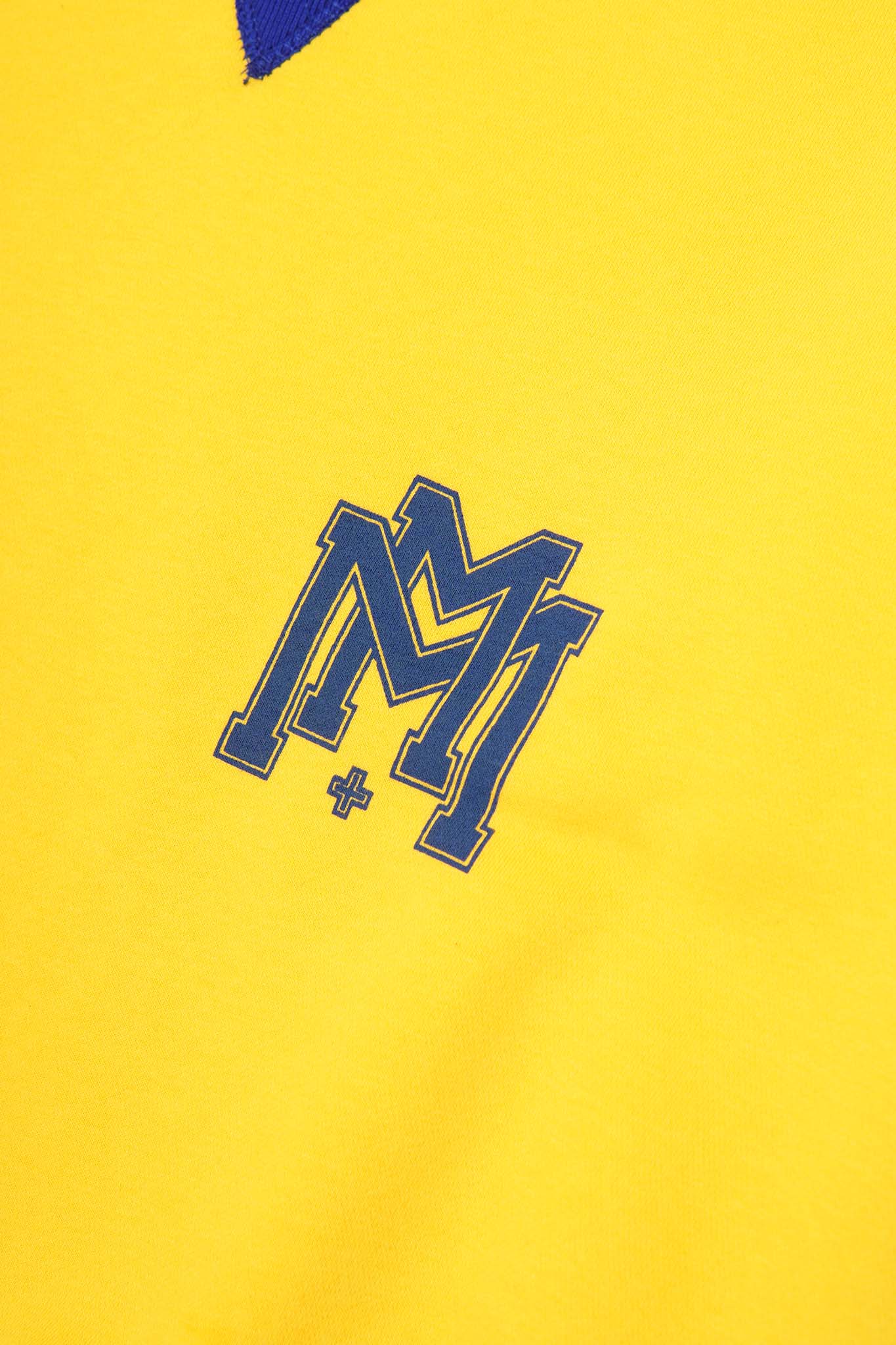 M'$ UNIVERSITY V2 IN CANARY YELLOW