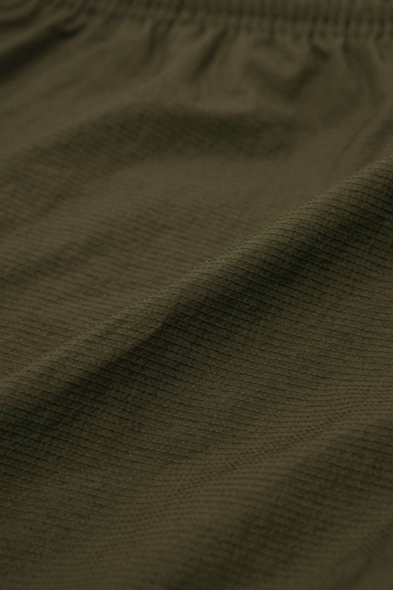 SHINOBI PLEATED HOUSE SHORTS IN OLIVE