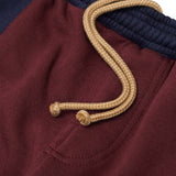ROGUE SPLIT WIDE PANTS IN BURGUNDY/NAVY