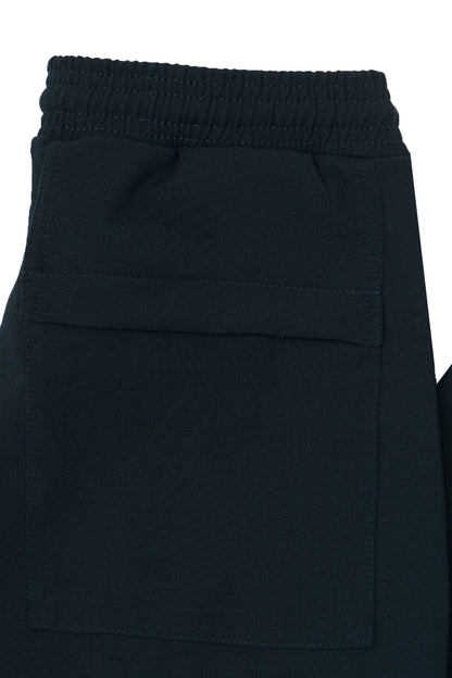 PLEATED CROPPED PANTS IN REGAL BLUE