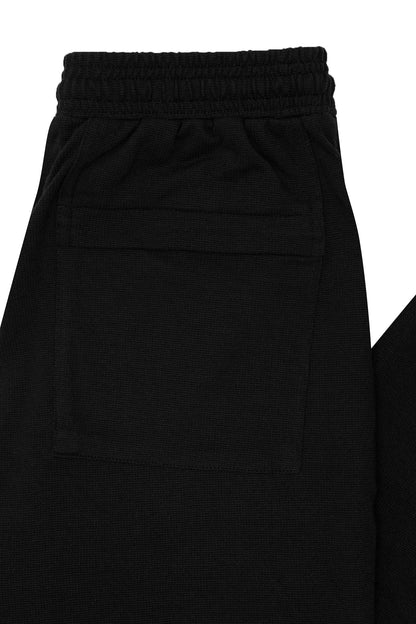 WAFFLE WEAVE PLEATED WIDE PANTS IN CAVIAR