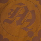 "CROP CIRCLES" MOCK NECK TEE IN RUST