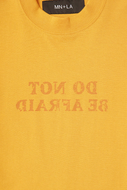 "DO NOT BE AFRAID" TEE IN MUSTARD