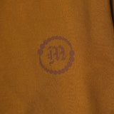 "CROP CIRCLES" MOCK NECK TEE IN RUST