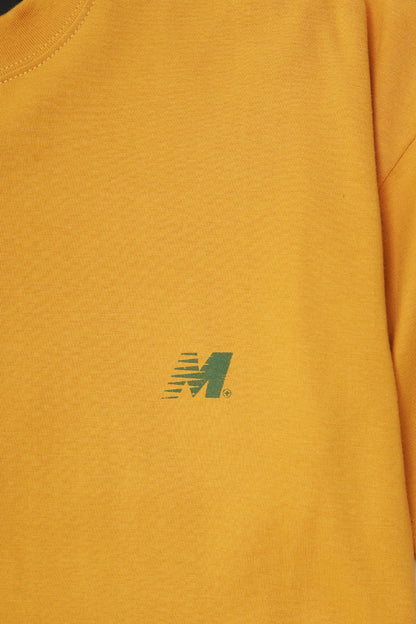 "OUTDOOR EXPLORATION" MULTI LOGO TEE IN MUSTARD
