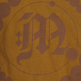 "CROP CIRCLES" MOCK NECK TEE IN RUST