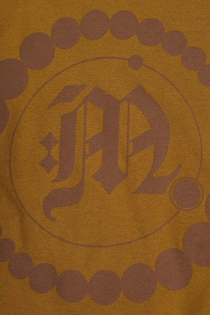 "CROP CIRCLES" MOCK NECK TEE IN RUST