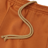 PLEATED WIDE LOUNGE PANTS IN TANGERINE