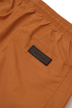 PLEATED HOUSE SHORTS IN SAFFRON