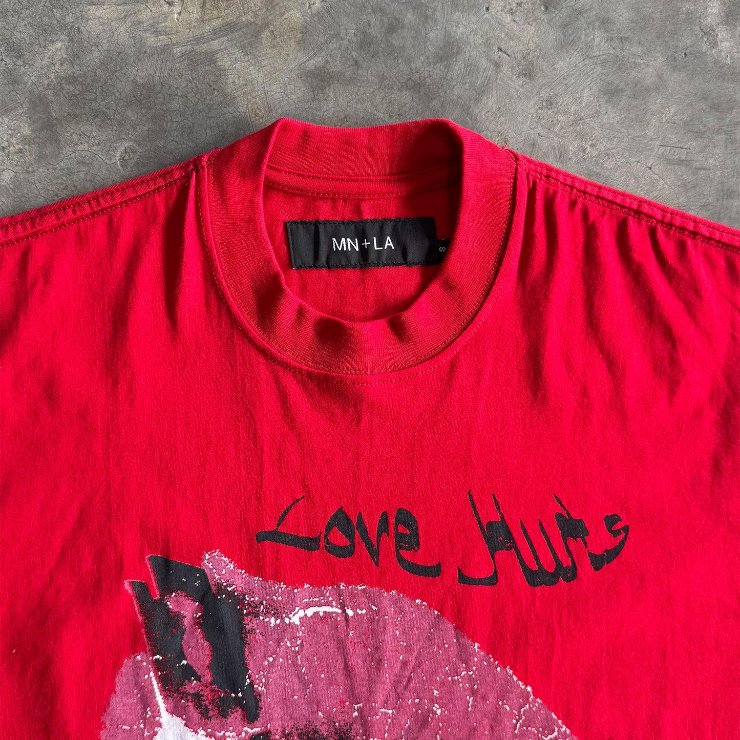 "LOVE HURTS" TEE IN RARRI RED