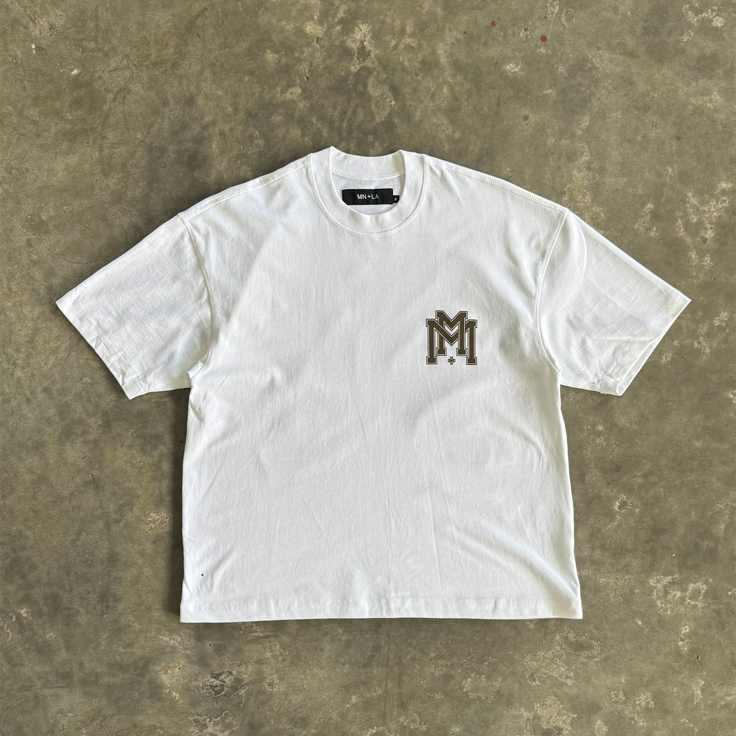 M'$ UNIVERSITY V2 TEE IN WHITE