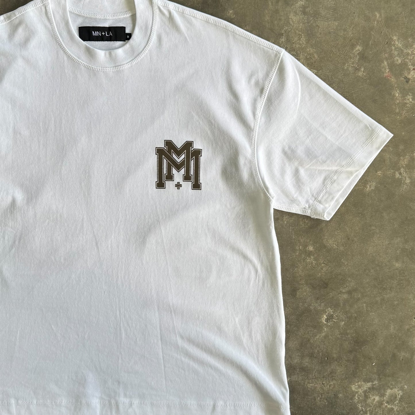 M'$ UNIVERSITY V2 TEE IN WHITE