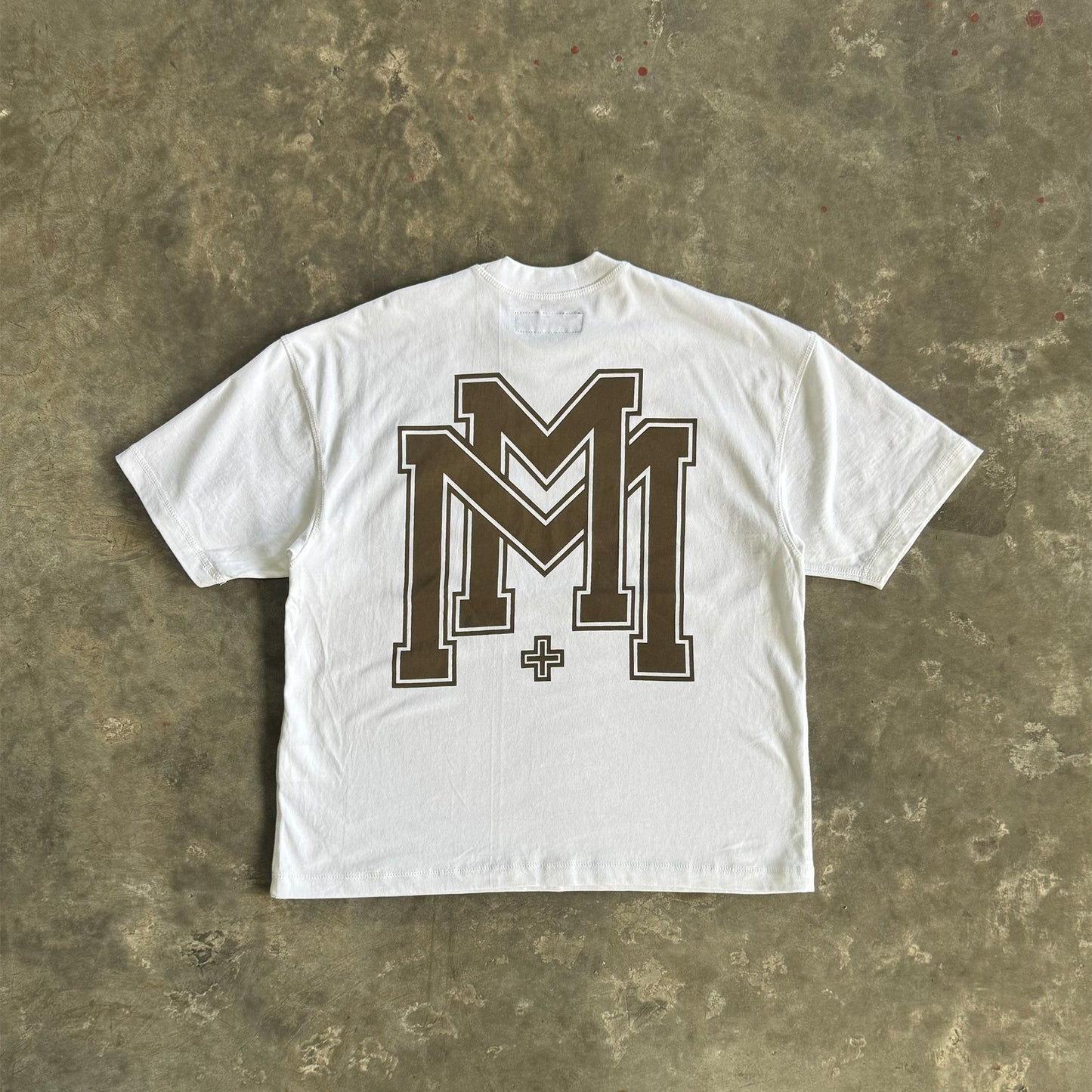 M'$ UNIVERSITY V2 TEE IN WHITE