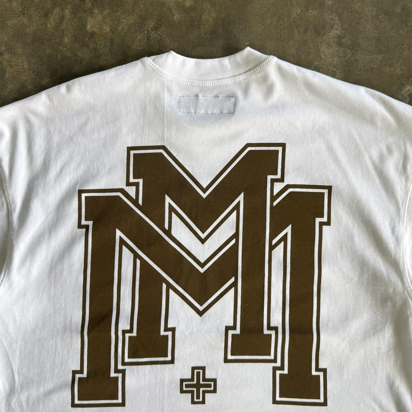 M'$ UNIVERSITY V2 TEE IN WHITE