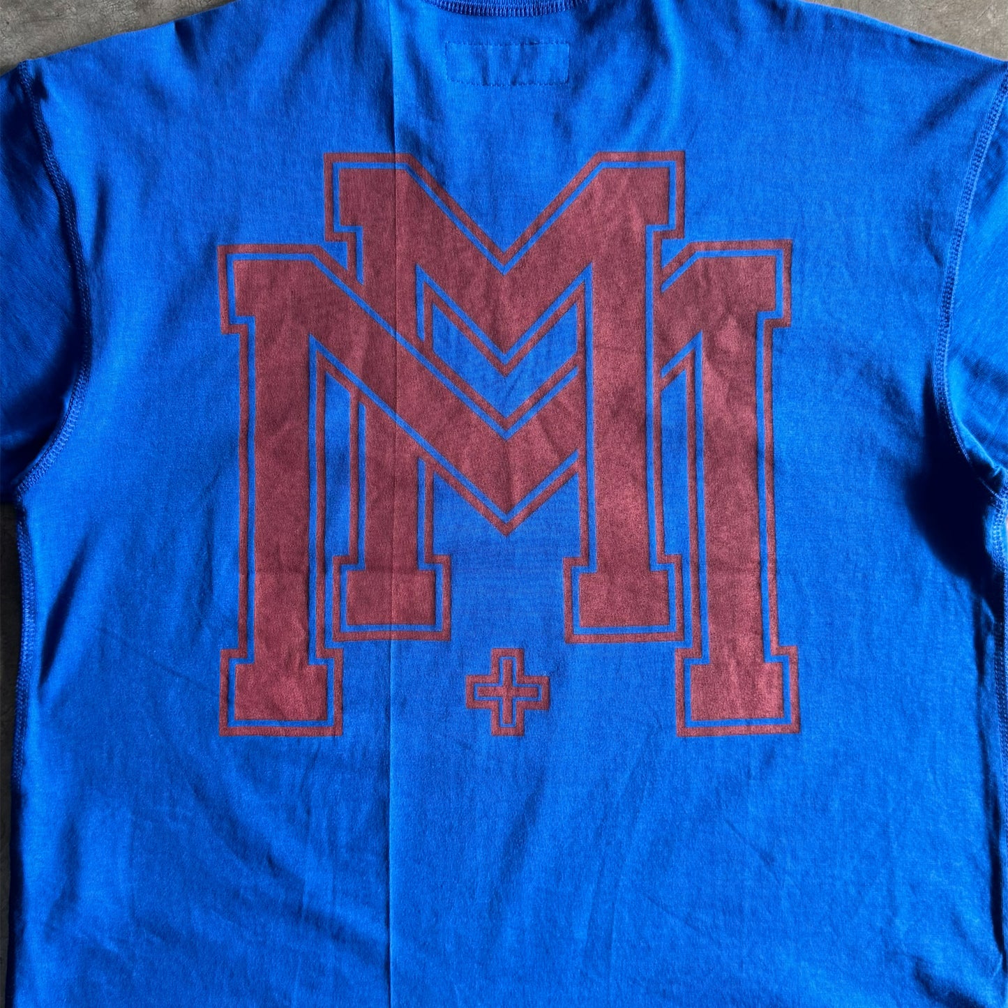 M'$ UNIVERSITY V2 TEE IN ELECTRIC BLUE