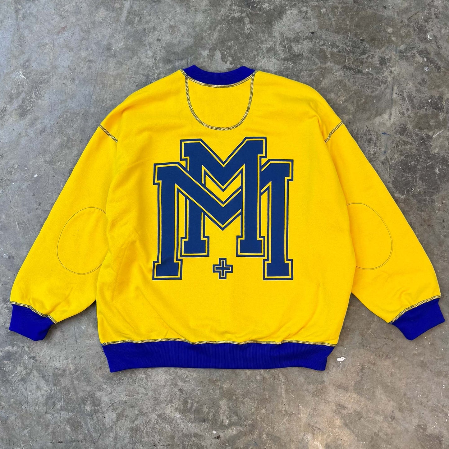 M'$ UNIVERSITY V2 IN CANARY YELLOW