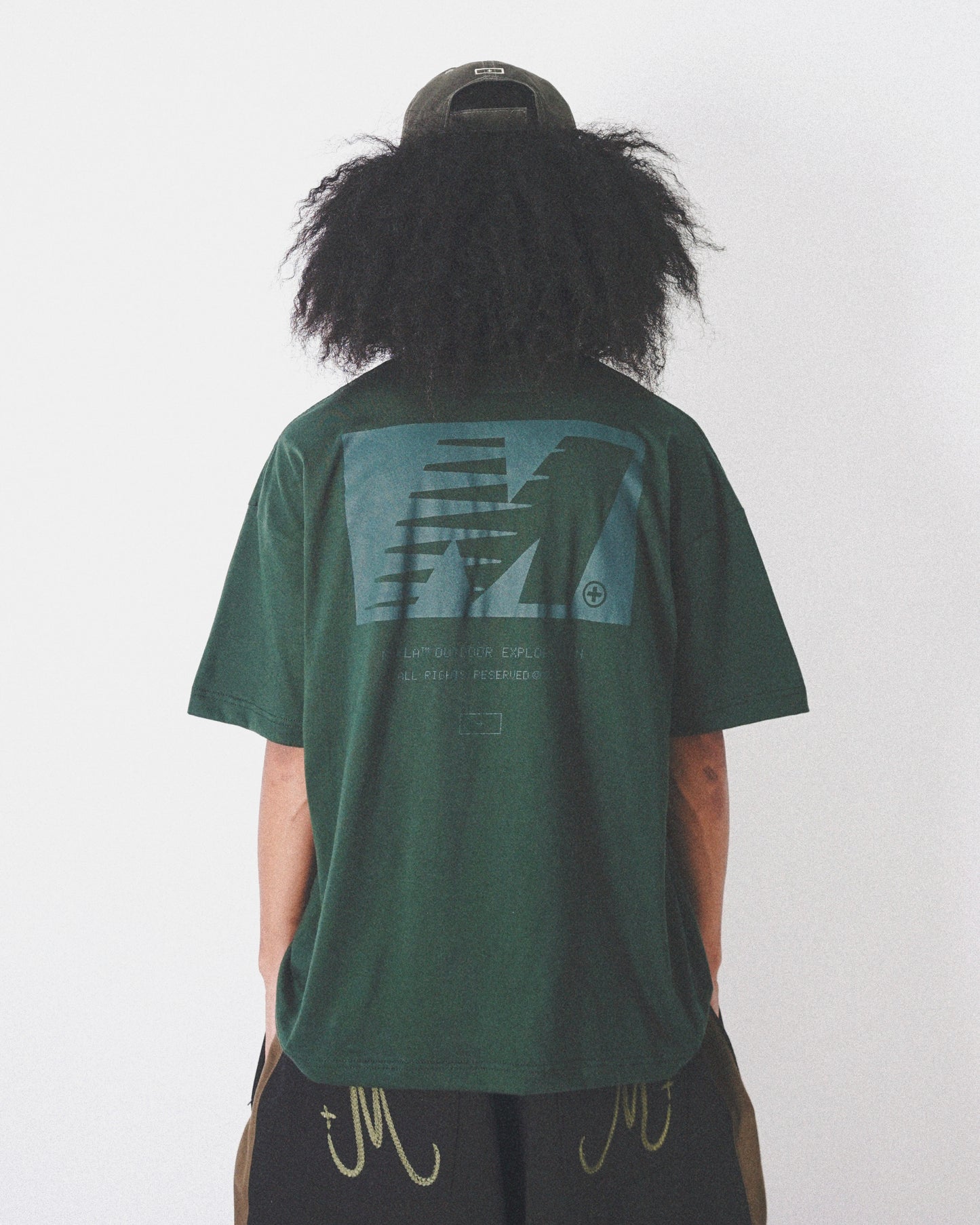 "OUTDOOR EXPLORATION" MULTI LOGO TEE IN HUNTER GREEN