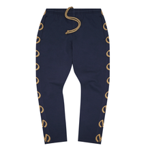"M'$ & BEYOND" TRACK PANTS IN NAVY BLUE