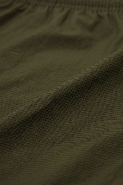 SHINOBI PLEATED HOUSE SHORTS IN OLIVE