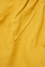 LINEN PLEATED HOUSE SHORTS IN MUSTARD