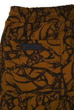 "VINES AND THORNS" 7 POCKET LOUNGE PANTS IN RUST