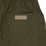 LINEN PLEATED HOUSE SHORTS IN OLIVE