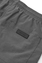 PLEATED HOUSE SHORTS IN STONE GREY