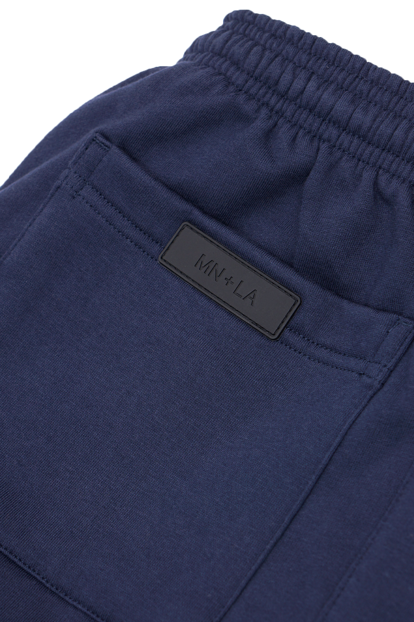 "M'$ & BEYOND" TRACK PANTS IN NAVY BLUE