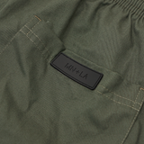 PLEATED HOUSE SHORTS IN MOSS GREEN