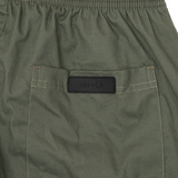 PLEATED HOUSE SHORTS IN MOSS GREEN