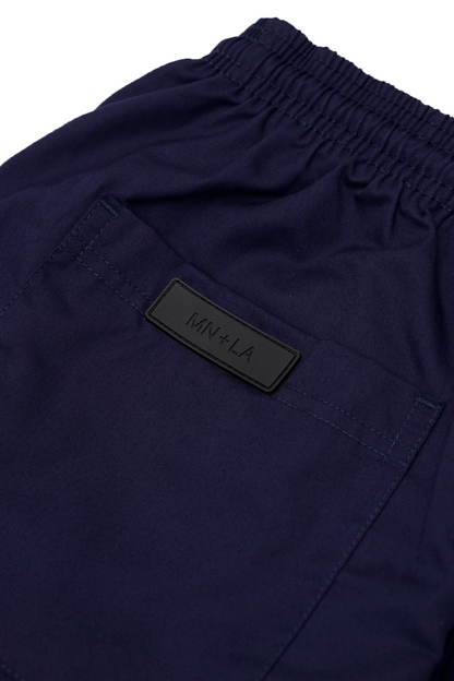 PLEATED WIDE CROPPED PANTS IN NAVY