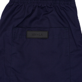 PLEATED WIDE CROPPED PANTS IN NAVY