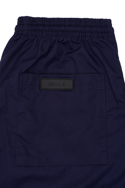 PLEATED WIDE CROPPED PANTS IN NAVY