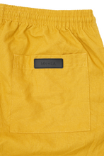 LINEN PLEATED HOUSE SHORTS IN MUSTARD