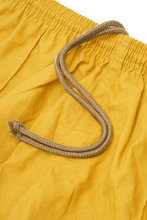 LINEN PLEATED HOUSE SHORTS IN MUSTARD