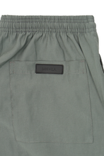 PLEATED ULTRA WIDE PANTS IN MOSS GREEN