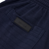 STRIPED PIQUE PLEATED ULTRA WIDE PANTS IN NAVY