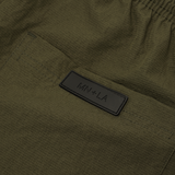 SHINOBI PLEATED HOUSE SHORTS IN OLIVE