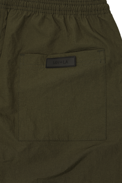 SHINOBI PLEATED HOUSE SHORTS IN OLIVE