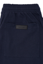 WAFFLE WEAVE PLEATED CROPPED PANTS IN NAVY BLUE