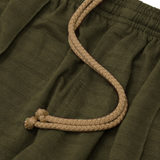 STRIPED PIQUE PLEATED ULTRA WIDE PANTS IN OLIVE