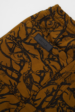 "VINES AND THORNS" 7 POCKET SWEATSHORTS IN RUST