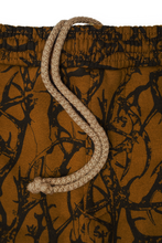 "VINES AND THORNS" 7 POCKET LOUNGE PANTS IN RUST